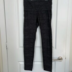 RYU athletic black leggings with grey line detail on front and back. Size M